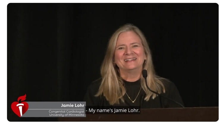 Dr. Lohr standing behind a podium