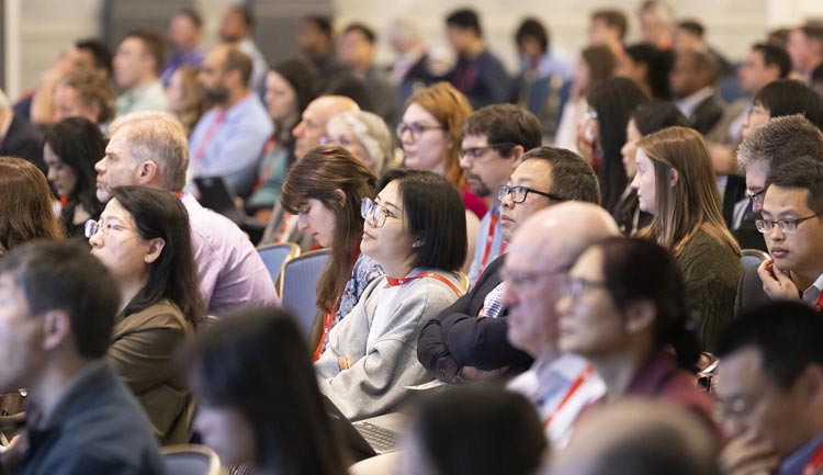 Audience members listen intently to a speaker during #VascularDiscovery25 in Baltimore, Maryland.