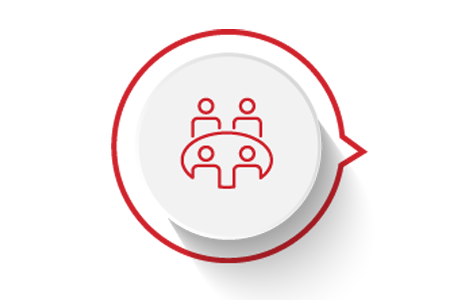 A red icon showing a small group of people around a table on a white background