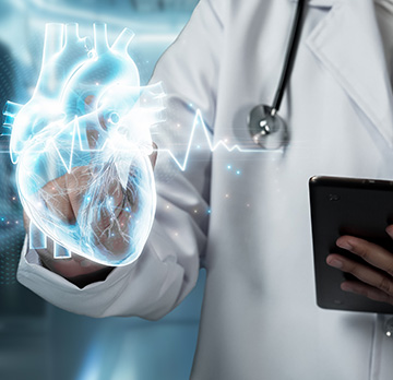 Close up of skilled doctor holding tablet and pointing at heart hologram floating at lab with blurring background. Medical worker checking and analyzing medical data by using technology.