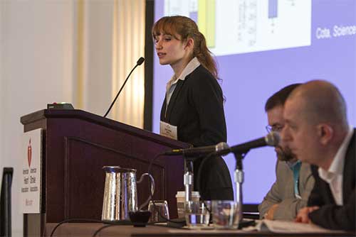 woman speaking at podium