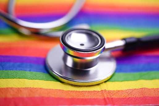black stethoscope on LGTB flag background