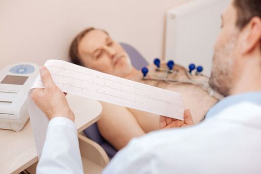 cardiologist studying patients cardiogram