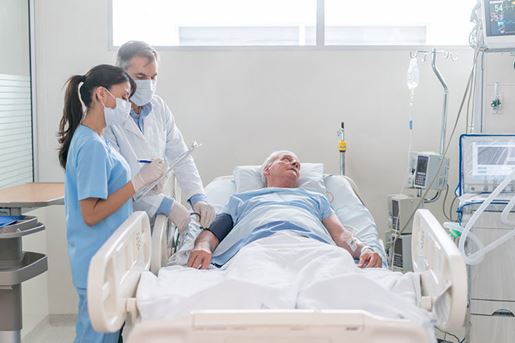 Doctors checking on patient at the ICU