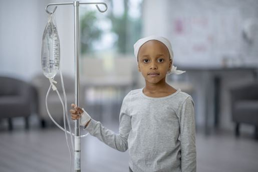 girl holding iv pole