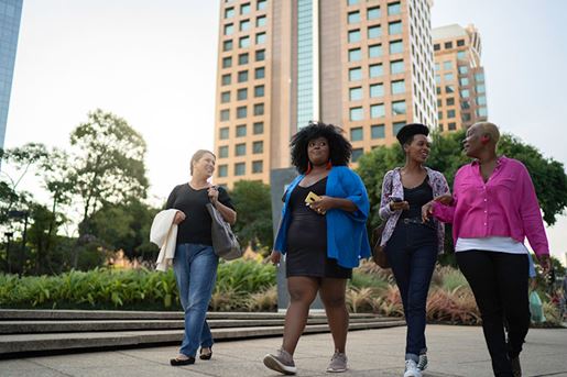 Group of women together walking in the city