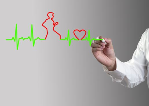 Hand drawing a cardiogram heartbeat wave and a person