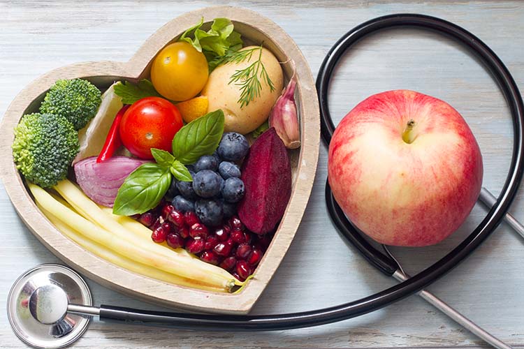 Healthy food in heart diet concept with stethoscope