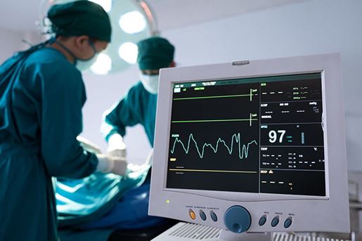 nurse using defibrillator