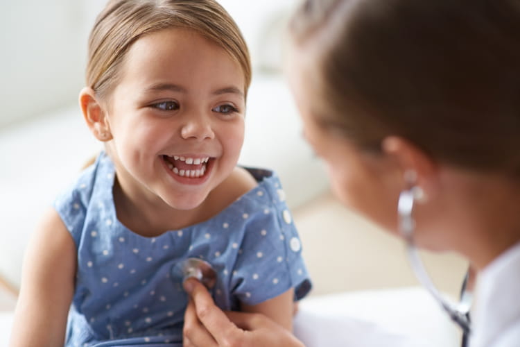 young girl with her pediatrician